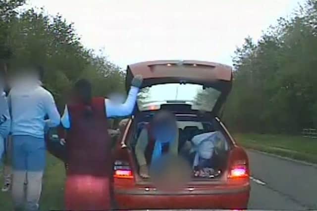 Police dashcam footage of the moment nine people emerge from a car pulled over in North Yorkshire