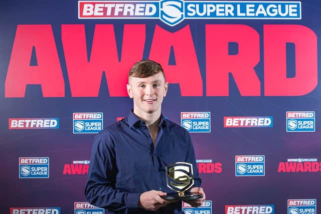 Leeds Rhinos' Harry Newman picks up his 2020 Super League Young Player of the Year award. (ALLAN MCKENZIE/SWPIX)
