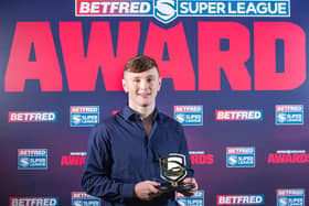Leeds Rhinos' Harry Newman picks up his 2020 Super League Young Player of the Year award. (ALLAN MCKENZIE/SWPIX)