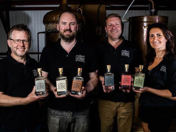 The team at York Gin with the company's new range of bottles