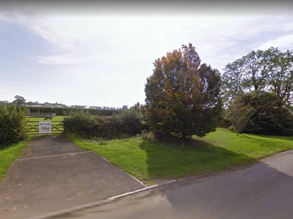 The children's play area in Bagby, with the airfield just behind it