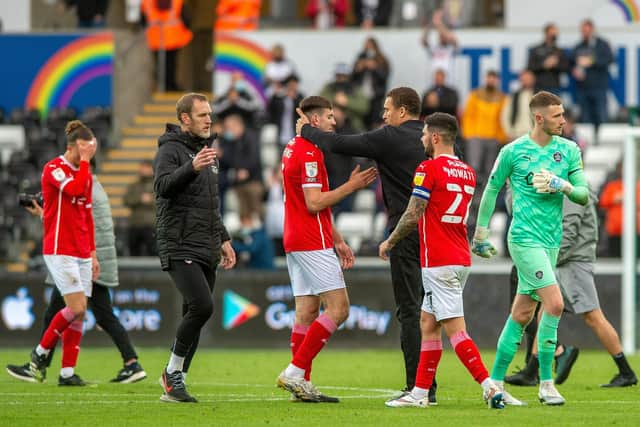 Valerien Ismael consoles his players at full-time after losing at Swansea City in the playoff semi-finals.  Picture: Bruce Rollinson