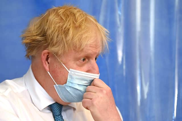 Britain's Prime Minister Boris Johnson visits Colchester hospital in Colchester the day after Mr Cummings gave evidence to MPs (Photo by GLYN KIRK/POOL/AFP via Getty Images)