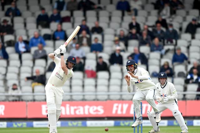 CLOSE CALL: Lancashire’s Luke Wells hits past Yorkshire’s Tom Kohler-Cadmore, who takes evasive action, on day two of the Roses County Championship clash at Old Trafford. Picture: gareth Copley/Getty Images.