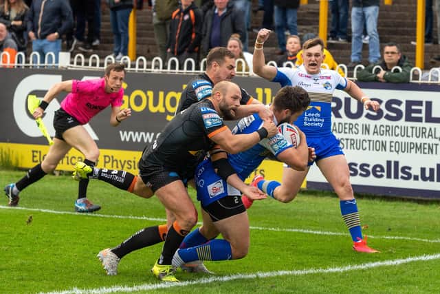 Tom Brisoce scorewe the Rhinos' first try.  Pictures: Bruce Rollinson