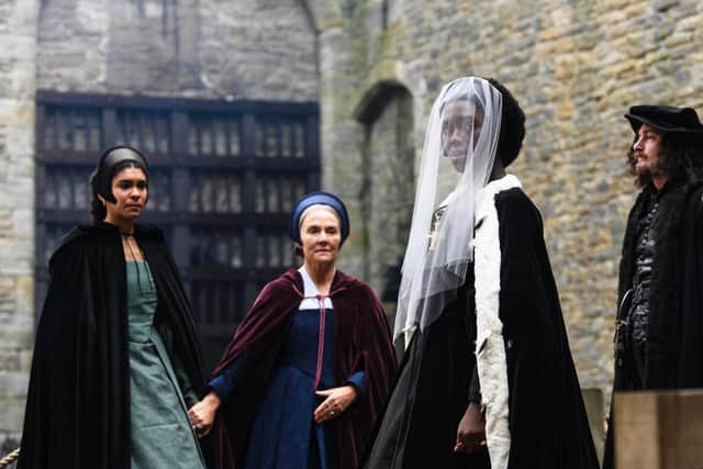 Anne Boleyn (Jodie Turner-Smith) at Bolton Castle, which was used as Greenwich Palace and here as the Tower of London for her execution. Credit Parisa Taghizadeh / Fable / The Falen Falcon. Also shows Madge Shelton (Thalissa Teixira), Lady Anne Shelton (Amanda Burton) and William Kingston (James Harkness).