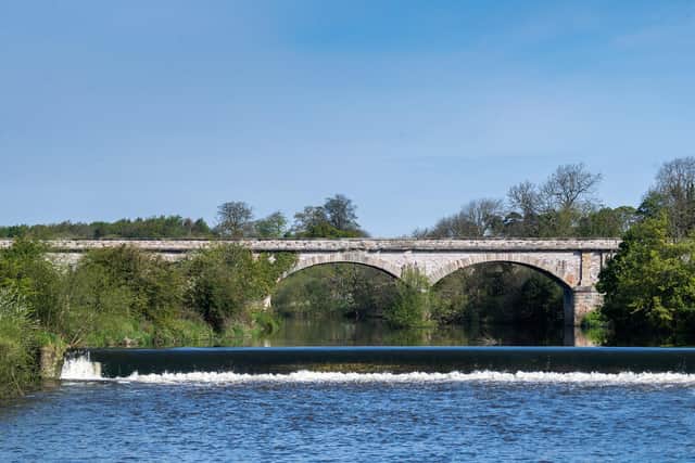 Tadcaster Weir on the River Wharfe with the railway viaduct towering behind. Picture: James Hardisty.