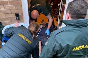 David, 71, was forced to lie with half of his body sticking out of the door because they were told by paramedics not to move him. (Credit: SWNS)