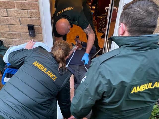 David, 71, was forced to lie with half of his body sticking out of the door because they were told by paramedics not to move him. (Credit: SWNS)