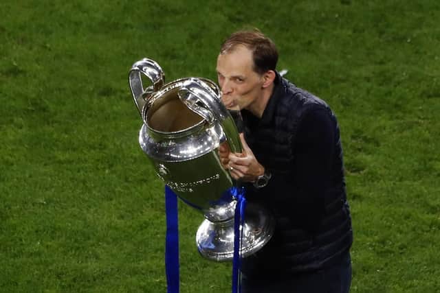 Chelsea's head coach Thomas Tuchel celebrates kissing the trophy. (Susana Vera/Pool via AP)