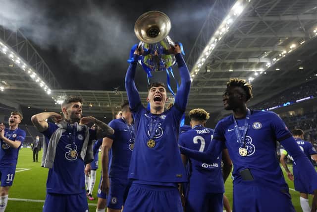 Chelsea's Kai Havertz celebrates with the trophy after winning the Champions League final soccer match between Manchester City and Chelsea at the Dragao Stadium in Porto. (AP Photo/Manu Fernandez, Pool)