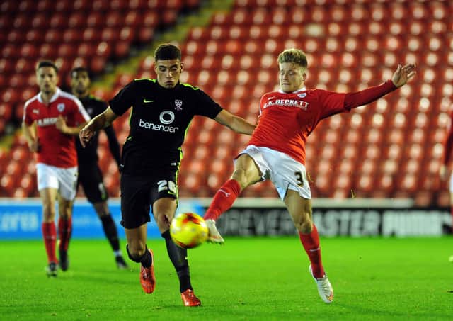 Ben Godfrey, left, playing for hometown York City in a Football League Trophy match with Barnsley in 2015 (Picture: Jonathan Gawthorpe)