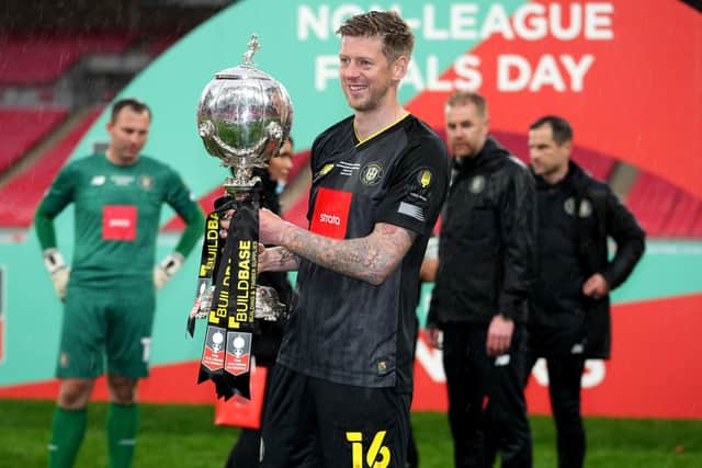 Harrogate Town's Jon Stead celebrates with the FA Trophy after the Wembley final earlier this month (Picture: PA)