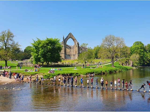 People enjoy the sunshine at Bolton Abbey in Yorkshire, as Bank Holiday Monday could be the hottest day of the year so far - with temperatures predicted to hit 25C in parts of the UK. 
PA WIRE