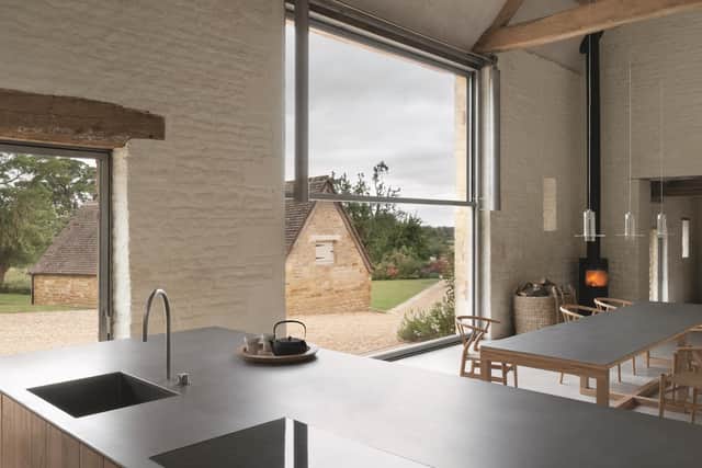 One of the three kitchens. This is in the barn area and has a steel-topped table designed by John Pawson