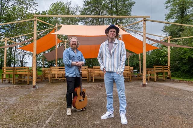 Tom Figgins, Musicia/Artist, who was on tour with Alew Wright, Director/Writer, whilst out in Australia, infront on their temporary outdoor theatre built on a disused tennis court in the grounds of the property to stage the production of Orpheus. Image James Hardisty