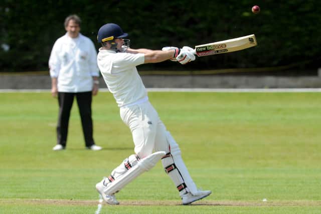 Big hit: Woodlands opener Sam Frankland hits a six in his innings of 42 during the Bradford League leaders 144-run victory over Wrenthorpe. Picture: Steve Riding