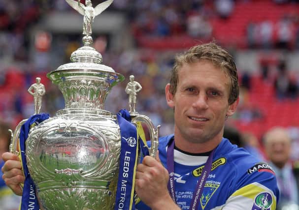 Winner: Warrington's man of the match Brett Hodgson holds the Challenge Cup. Picture: PA
