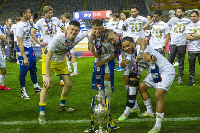 Illan Meslier, Ben White, Kalvin Phillips and Tyler Roberts with the Championship trophy at Elland Road. Picture Tony Johnson