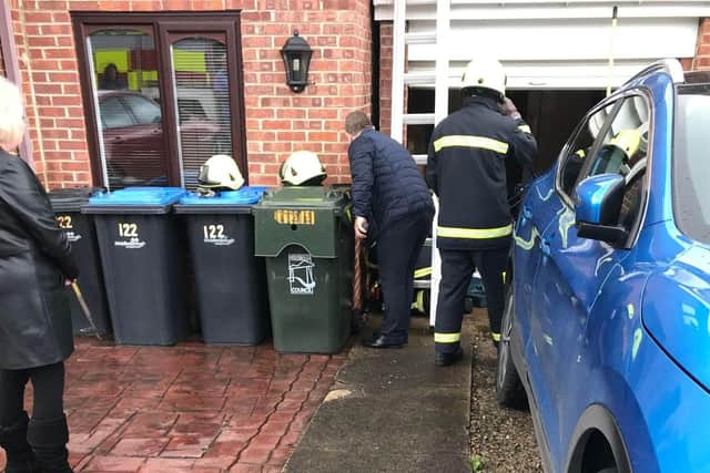Poor Kevin the cat was rescued after getting wedged in a three-inch gap between a house and a garage. Picture: RSPCA