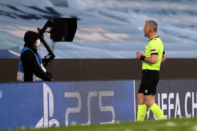 Video check: Referee Bjorn Kuipers consults the VAR pitch side monitor for a penalty decision during the UEFA Champions League semi-final second leg at the Etihad Stadium.