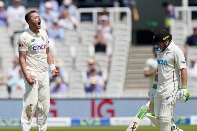 England's Ollie Robinson celebrates taking the wicket of New Zealand's Tom Latham.