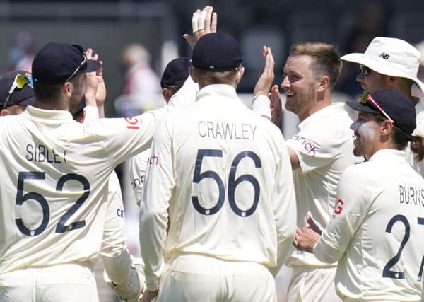 Wicket: England's Ollie Robinson celebrates taking the wicket of New Zealand's Colin de Grandhomme. Picture: AP Photo/Kirsty Wigglesworth