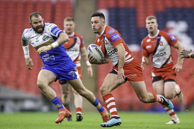 RETURN TICKET PLEASE: Niall Evalds in action for Salford against Leeds's Adam Cuthbertson in last year's Challenge Cup FInal. Picture by Allan McKenzie/SWpix.com