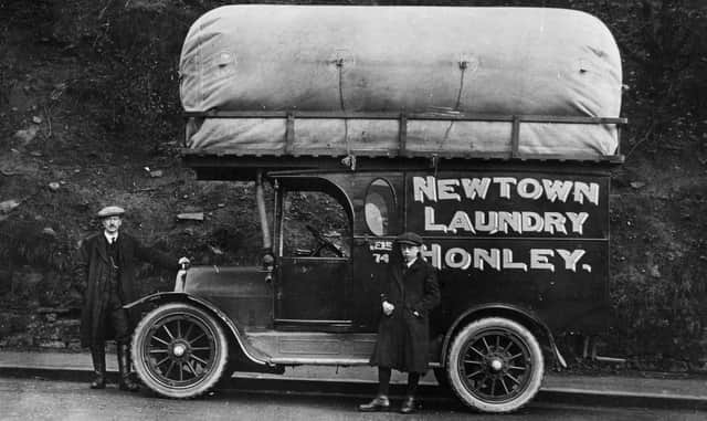 circa 1925:  A mobile laundrette operating in Newtown, Honley, provides a shirt and collar dressing service as well as dyeing and dry-cleaning for West Riding and Yorkshire.  (Photo by Chaloner Woods/Getty Images)