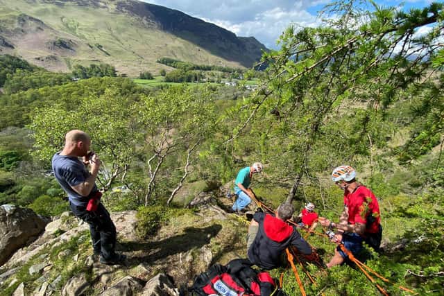 Rescue personnel on the scene at Quayfoot Buttress in Borrowdale, Lake District. (Credit: SWNS)