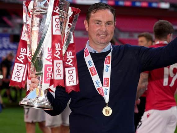 Last act?: Morecambe manager Derek Adams celebrates with the trophy after the Sky Bet League Two play-off final - but has been linked with the vacancy at Bradford City. Picture: John Walton/PA Wire.