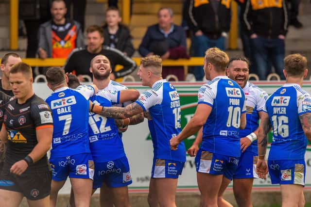 Demolition derby: Leeds' Luke Briscoe celebrates scoring his second try in the 60-6 win at 
Castleford Tigers.  Picture Bruce Rollinson