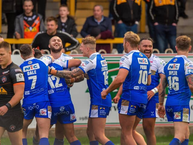 Demolition derby: Leeds' Luke Briscoe celebrates scoring his second try in the 60-6 win at 
Castleford Tigers.  Picture Bruce Rollinson