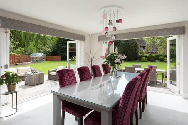 The bespoke dining table with views over the garden