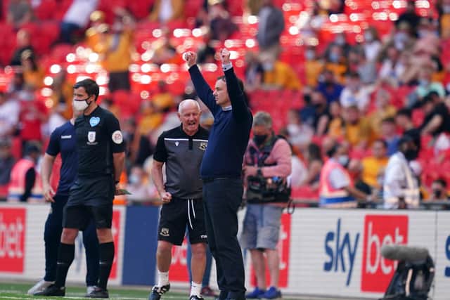 SUCCESS: Derek Adams celebrates on the touchline towards the end of the League Two playoff final at Wembley as Morecambe sealed promotion. Picture: John Walton/PA