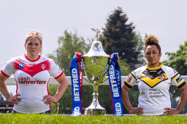 READY FOR BATTLE: St Helens' Amy Hardcastle and York City Knights' Kelsey Gentles pictured with the Betfred Women's Challenge Cup trophy. Picture: Alex Whitehead/SWpix.com.