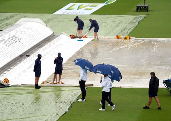 Umpires inspect the pitch as play continues to be delayed due to rain during day three of the first Test match at Lord's. Picture: Adam Davy/PA