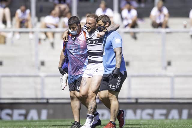Cruel blow: Hull FC's Josh Griffin is helped from the field after injury against St Helens. Pictures: SWPix