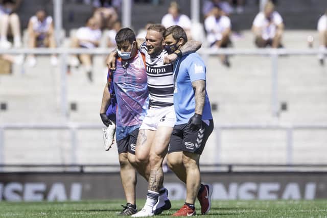 Season ending: Hull FC's Josh Griffin is helped from the field after injury against St Helens. Picture by Allan McKenzie/SWpix.com