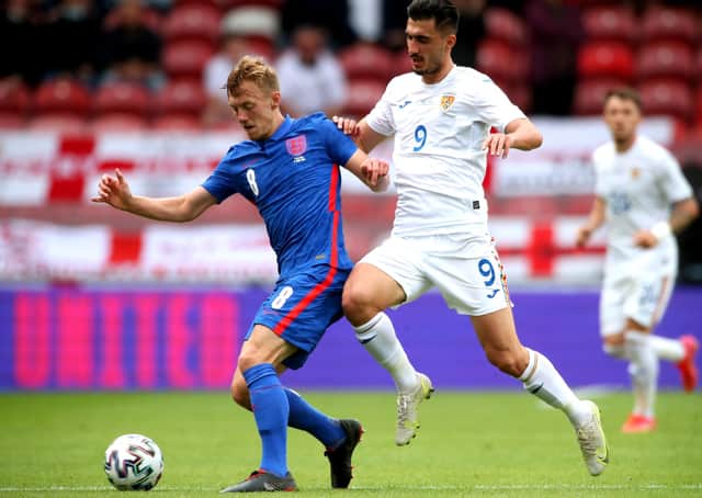 England's James Ward-Prowse (left) and Romania's Andrei Ivan battle for the ball during the international friendly match at Riverside Stadium, Middlesbrough. Picture date: Sunday June 6, 2021. PA Photo. See PA story SOCCER England. Photo credit should read: Nick Potts/PA Wire.Use subject to FA restrictions. Editorial use only. Commercial use only with prior written consent of the FA. No editing except cropping.