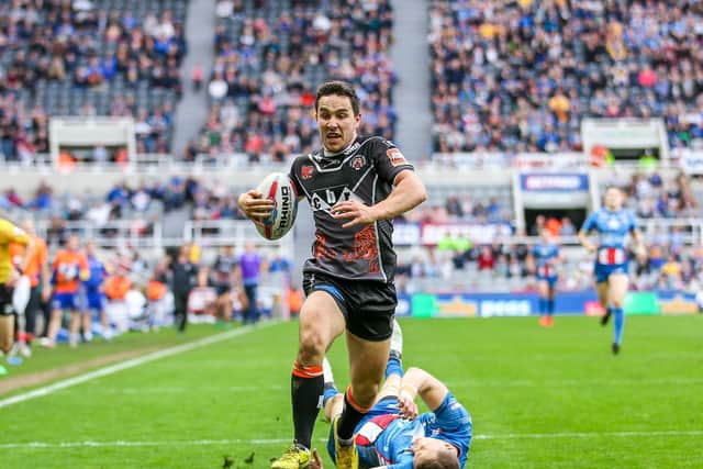 Tom Holmes scores for Castleford Tigers against Leeds Rhinos at Magic Weekend in Newcastle in 2017 (ALEX WHITEHEAD/SWPIX)