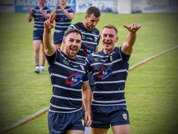 Tom Holmes, left, celebrates reaching Wembley after Featherstone Rovers' win over Widnes Vikings. (Dec Hayes Photography)