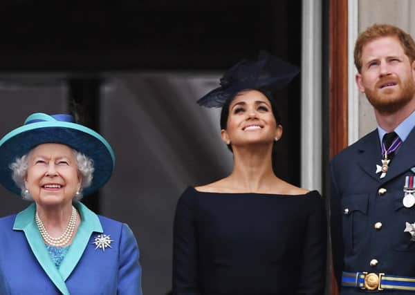 The Queen with the Duke and Duchess of Sussex in 2018.