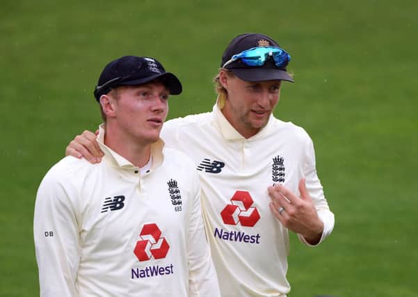 England's Joe Root (right) and Dom Bess.