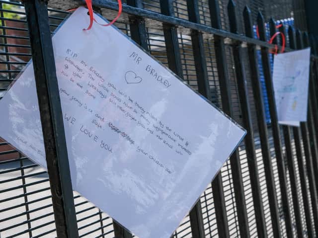 Tributes hung on the gates of the school