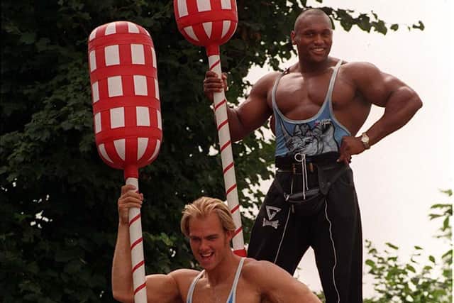 Crosley as Hunter in 1997 with fellow Gladiator Rhino. Picture: PA Archive.
