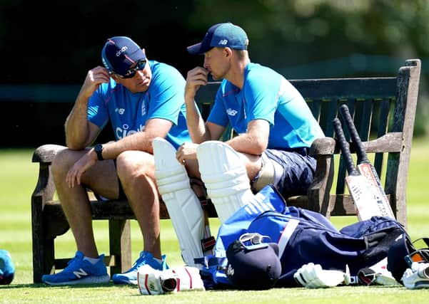 Careful whispers: England captain Joe Root, right, and coach Chris Silverwood, left, share some thoughts during a break in the nets session at Edgbaston yesterday. (Picture: PA)