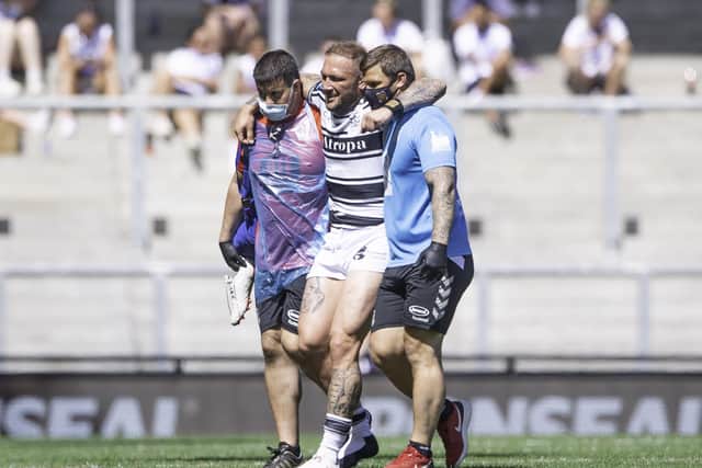 Hull FC's Josh Griffin is helpd from the pitch after injurying his Achilles in last Saturday's Challenge Cup semi-final against St Helens. Picture: Allan McKenzie/SWpix.com.