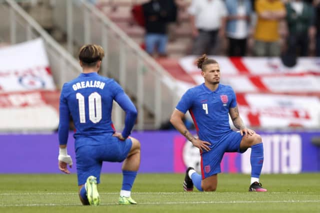 England's Jack Grealish and Kalvin Phillips take a knee. Picture: PA