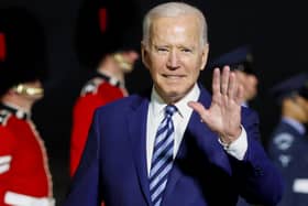 US President Joe Biden waves on arrival on Air Force One at Cornwall Airport Newquay ahead of the G7 summit.
